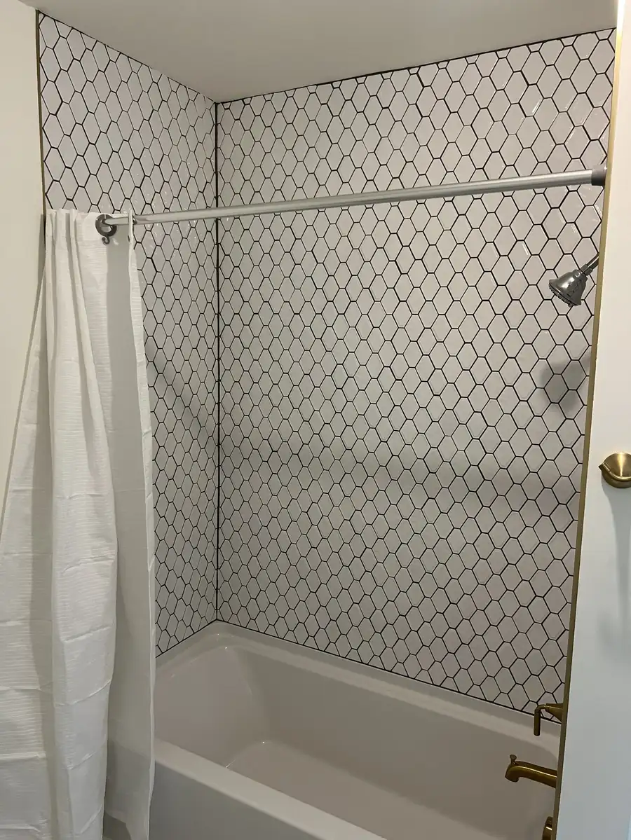 Tub and shower with patterned tile surround