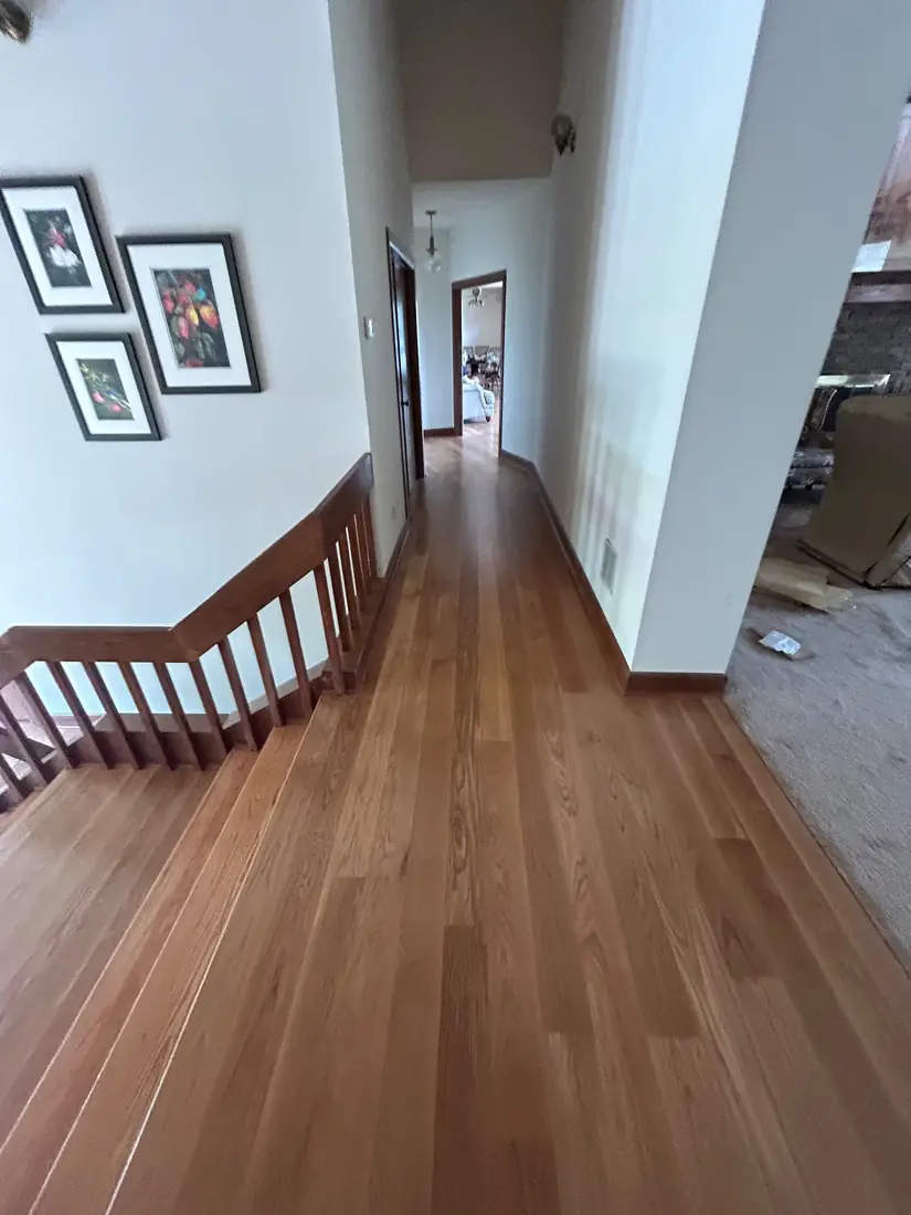 Refinished hardwood flooring and staircase