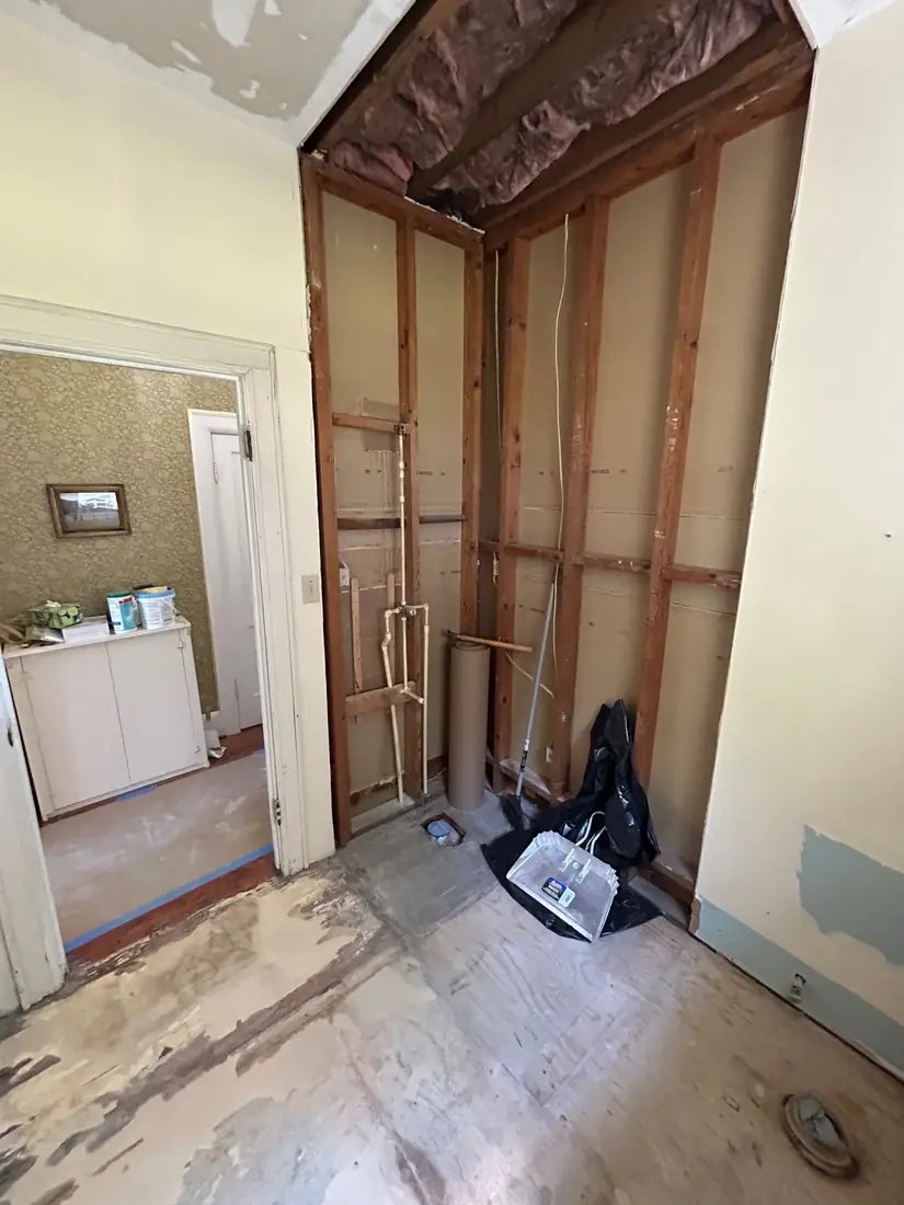 Same bathroom stripped to the studs before the renovation