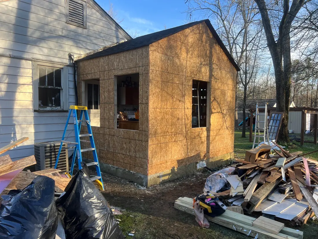 Same outbuilding sheathed, before siding