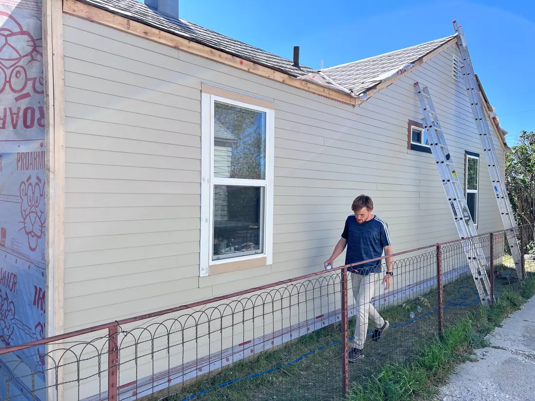 New siding going up over house wrap