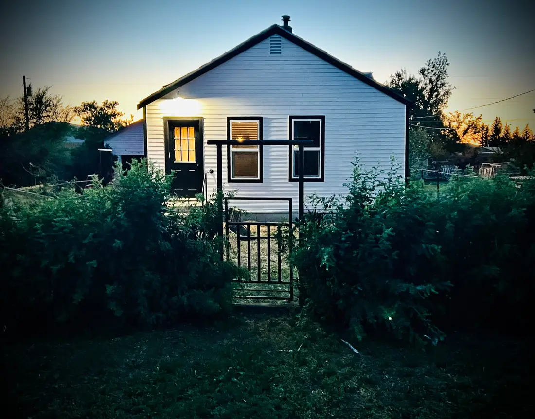 Completed home exterior renovation at dusk