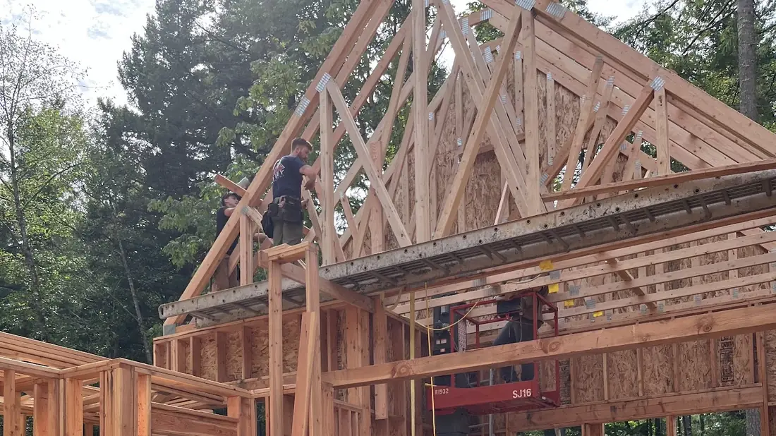 Roof trusses being set on a new home build